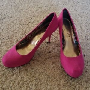Hot pink suede pumps